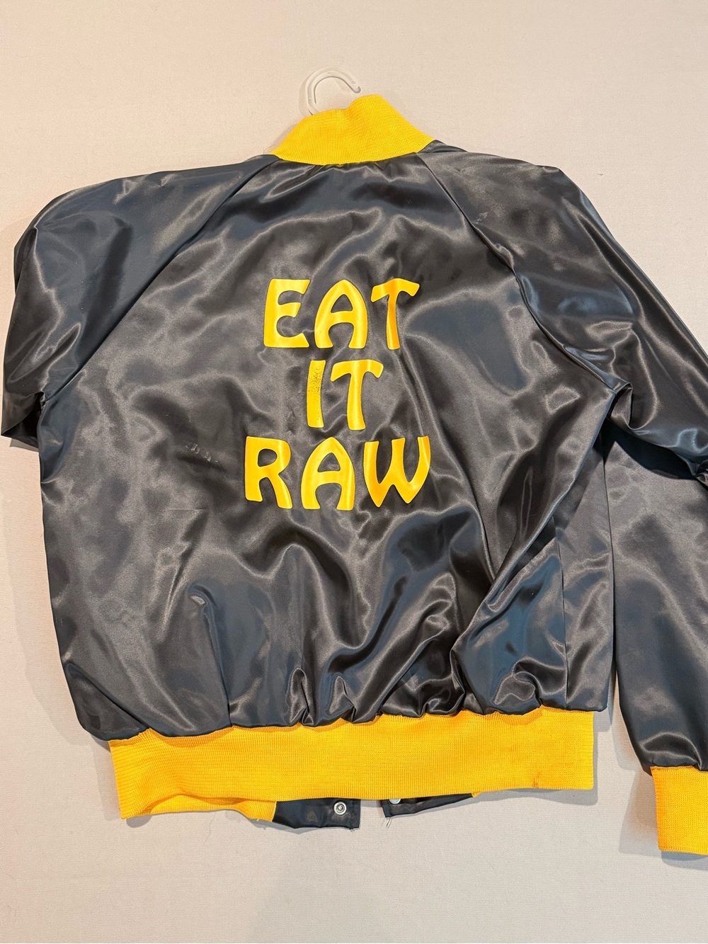 Vintage 1980’s “Eat It Raw” Satin Bomber Jacket - Black/Yellow Mens L
